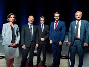 NDP Leader Jennifer McKenzie, left to right, Green Party Leader David Coon, People's Alliance Leader Kris Austin, Liberal Leader Brian Gallant and PC Leader Blain Higgs pose for photos before the start of the New Brunswick leaders debate in Riverview, N.B., Wednesday, Sept. 12, 2018.