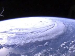 This image provided by NASA shows Hurricane Florence from the International Space Station on Wednesday, Sept. 12, 2018, as it threatens the U.S. East Coast. Hurricane Florence is coming closer and getting stronger on a path to squat over North and South Carolina for days, surging over the coast, dumping feet of water deep inland and causing floods from the sea to the Appalachian Mountains and back again. (NASA via AP)