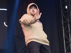 FILE - In this Oct. 2, 2016 file photo, Mac Miller performs at the 2016 The Meadows Music and Arts Festivals at Citi Field in Flushing, N.Y. Miller, the platinum hip-hop star whose rhymes vacillated from party raps to lyrics about depression and drug use, has died at the age of 26. A family statement released through his publicists says Miller died Friday, Sept. 7, 2018, and there are no further details available on how he died.