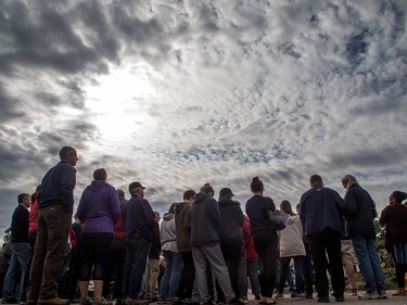 Pastor Mike Hogeboom adresses his congregation outside Arlington Woods First Methodist Church.