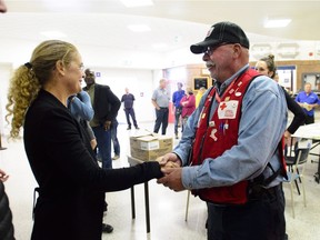 Gov. Gen. Julie Payette talks with Canadian Red Cross volunteer Dave Small during a visit to Dunrobin a few days after the community was struck by a tornado.