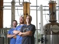 Anthony Seed, head of sales, Neal McCarten, director of operations, and Omid McDonald, CEO, pose for a photo at Dairy Distillery in Almonte.  Tony Caldwell/Postmedia