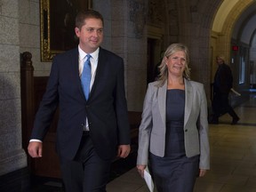 Leader of the Opposition Andrew Scheer walks with Leona Alleslev, who crossed the floor from the Liberal party to Conservative party before Question Period on Parliament Hill in Ottawa, Monday, September 17, 2018.