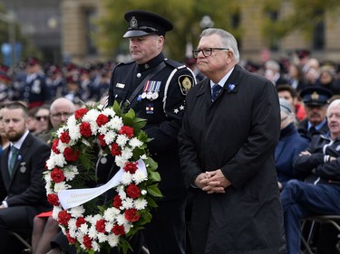 Minister of Public Safety and Emergency Preparedness Ralph Goodale prepares to lay a wreath during the Canadian Police and Peace Officers' Memorial Service on Parliament Hill on Sunday.