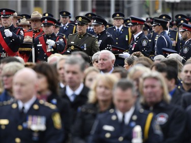 The headgear of fallen officers arrives at the Canadian Police and Peace Officers' Memorial Service on Parliament Hill on Sunday.