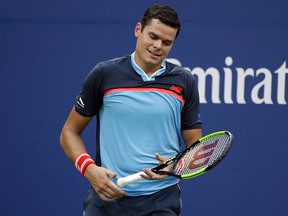 Milos Raonic reacts after losing a point to John Isner during the fourth round of the U.S. Open, Sunday, Sept. 2, 2018, in New York. (THE CANADIAN PRESS/AP/Jason DeCrow)