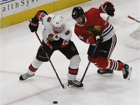 Ottawa Senators centre Matt Duchene (95) and Chicago Blackhawks defenceman Jan Rutta (44) go for the puck during the second period on Thursday, Sept. 27, 2018, in Chicago.