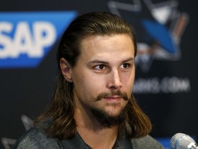 Newly acquired San Jose Sharks defenseman Erik Karlsson speaks during a news conference in San Jose, Calif., Wednesday, Sept. 19, 2018.