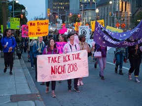 Demonstrators march along Elgin Street during the 40th annual Take Back The Night event in Ottawa on Thursday, Sept. 20, 2018.