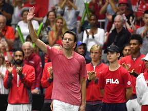 Daniel Nestor acknowledges the cheers of spectators following his match with doubles partner Vasek Pospisil against Matwe Middelkoop and Jean-Julien Rojer of the Netherlands in Davis Cup action in Toronto on Saturday.