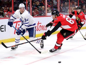 Chris Tierney (back) was wearing No. 71 when the Senators played the Toronto Maple Leafs at the Canadian Tire Centre on Wednesday night.