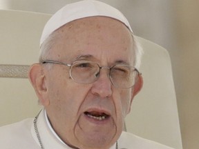 FILE - In this Wednesday, Sept. 26, 2018, file photo, Pope Francis delivers his message during his weekly general audience in St. Peter's Square at the Vatican. The former Vatican ambassador who accused three popes and their advisers of covering up for a disgraced American ex-cardinal has denounced Pope Francis' refusal to directly respond to his claims and challenged the Vatican to say what it knows about the scandal.