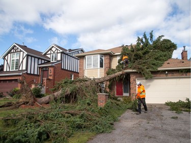 A damaged home in Craig Henry on Saturday morning as residents in Ottawa's west end deal with the aftermath of the twister that touched down on Friday afternoon.