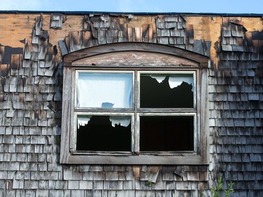 A damaged home in the Craig Henry neighbourhood on Saturday morning as residents in Ottawa's west end deal with the aftermath of the twister that touched down on Friday afternoon