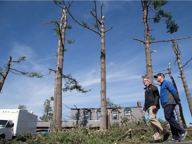 Mayor Jim Watson and Councillor Keith Egli tour Arlington Woods as the region continues to deal with the after effects of the tornados that struck the region on Friday.