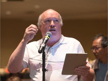 Arlington Woods resident Andrew Brewin addresses city officials at one of the two information sessions for residents affected by the Sept. 21 tornado and windstorm. Wayne Cuddington/Postmedia