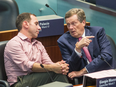 Toronto Mayor John Tory, right, talks with Councillor Josh Matlow during a meeting on Sept. 13, 2018 where city council voted to challenge Ontario's Bill 31 - which would shrink the size of council - in the courts.