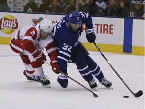 Toronto Maple Leafs left wing Josh Leivo (32) and Justin Abdelkader of the Detroit Red Wings (2) on Friday September 28, 2018.