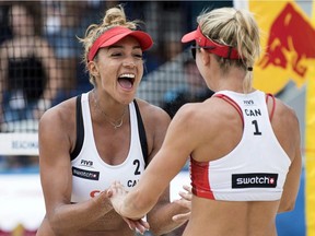 Canada's Brandie Wilkerson, left, and her teammate Heather Bansley celebrate during a women's quarter final game at the Beachvolley Worldtour Major Series, in Gstaad, Switzerland in July. Brandie Wilkerson, of Toronto, was voted as the FIVB best blocker for the first time.