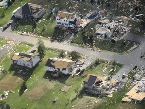 Damage from a tornado is seen in Dunrobin, Ont., west of Ottawa on Saturday, Sept. 22, 2018. The storm tore roofs off of homes, overturned cars and felled power lines in the Ottawa community of Dunrobin and in Gatineau, Que.