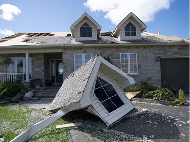 A dormer that was torn from a home's roof by a tornado is seen in Dunrobin, Ont., west of Ottawa, on Saturday, Sept. 22, 2018. The storm tore roofs off of homes, overturned cars and felled power lines in the Ottawa community of Dunrobin and in Gatineau, Que.