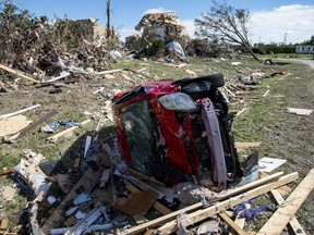 A car destroyed by a tornado is seen in Dunrobin, Ont., west of Ottawa, on Saturday, Sept. 22, 2018. The storm tore roofs off of homes, overturned cars and felled power lines in the Ottawa community of Dunrobin and in Gatineau, Que.