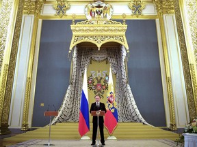 File - In this file photo taken on Wednesday, June 28, 2017, Russian President Vladimir Putin addresses graduates of the military and police academies in Moscow's Kremlin, Russia. Experts say President Vladimir Putin isn't necessarily dictating every Russian influence campaign abroad. Some accused of meddling in the 2016 U.S. elections appear to be ambitious individuals taking the initiative based on signals from the presidential entourage. Gun activist Maria Butina is one example. Others seem to be much closer to Putin himself.
