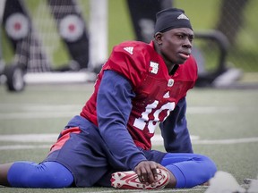 MONTREAL, QUE.: MAY 29, 2017 -- Montreal Alouettes safety Chris Ackie stretches during training camp at Bishop's University in Lennoxville