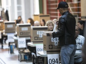 A voter casts his ballot in Westmount–St-Louis riding, for the Quebec provincial election on Monday October 1, 2018. (Pierre Obendrauf / MONTREAL GAZETTE)