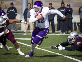 The Western Mustangs were in Ottawa to play the uOttawa Gee-Gees Saturday October 13, 2018 at the Gee-Gees Field. Mustangs #12 Chris Merchant gets the ball away from the Gee-Gees Saturday afternoon.   Ashley Fraser/Postmedia