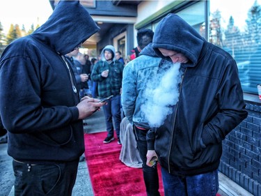 People wait in line outside Nova Cannabis in Calgary, on Wednesday October 17, 2018.
