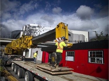 Rideau Canal Skateway buildings were being lowered onto the edge of the canal Saturday October 20, 2018 with a massive large crane. Danny Bertrand operating the crane and Conor Cameron prepare everything before the building was lift over on the canal.