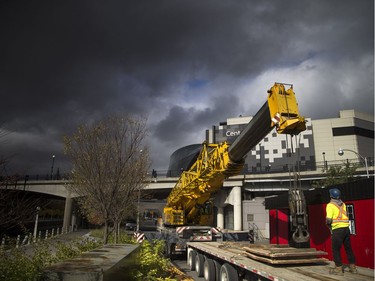 Rideau Canal Skateway buildings were being lowered onto the edge of the canal Saturday October 20, 2018 with a massive large crane. Danny Bertrand operating the crane and Conor Cameron prepare everything before the building was lift over on the canal.