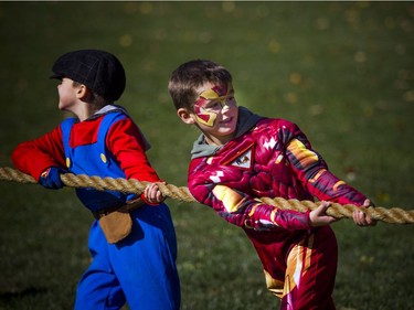 "Ironman" Oliver Maxwell-Swinburne and his brother Super Mario, also known as Jude, teamed up in the tug of war.   Ashley Fraser/Postmedia