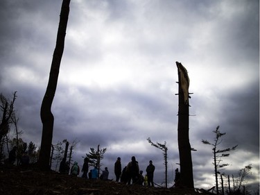 The Arlington Community Association held a special ceremony, procession and community gathering on the edge of Bruce Pit on Sunday, exactly a month after a tornado tore through the area.