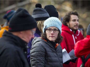 Lisa Wright listens to the speakers during the Arlington Community Association's special ceremony on the edge of Bruce Pit on Sunday.