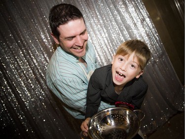 François Hachey and seven-year-old William, from New Brunswick, had fun at the Kid Food Nation gala's photo booth Sunday.   Ashley Fraser/Postmedia