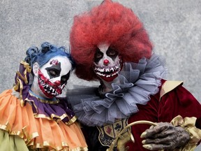 Zombies walk the streets of Montreal during the annual Zombie Walk in Montreal on Saturday, Oct. 27, 2018.