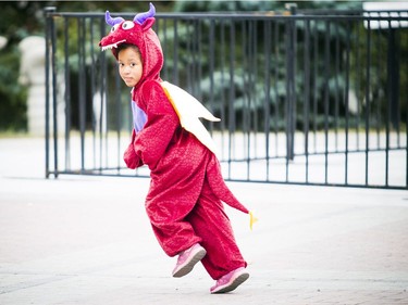 Six-year-old Arielle Villeneuve in her dragon costume on Saturday.   Ashley Fraser/Postmedia