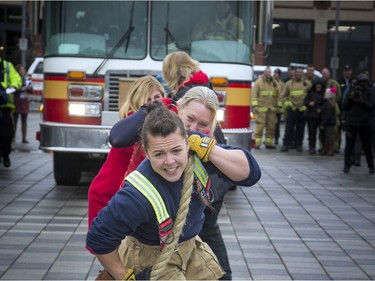 Teams of 10 came to Lansdowne Park to pull a 10 tonne fire truck 100 feet for the inaugural Ottawa Fire Truck Pull Sunday October 28, 2018. Teams compete to see who could pull the truck the fastest, raise the most money and demonstrate the best team spirit.  Helena Inaloz with Ottawa Fire Services helped out the politicians team Sunday afternoon.   Ashley Fraser/Postmedia
