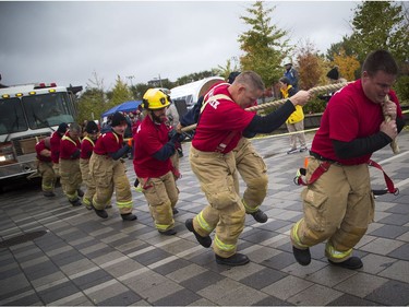Teams of 10 came to Lansdowne Park to pull a 10 tonne fire truck 100 feet for the inaugural Ottawa Fire Truck Pull Sunday October 28, 2018. Teams compete to see who could pull the truck the fastest, raise the most money and demonstrate the best team spirit. Team Shrek made up of members of the Ottawa Fire Services took part Sunday afternoon.   Ashley Fraser/Postmedia
