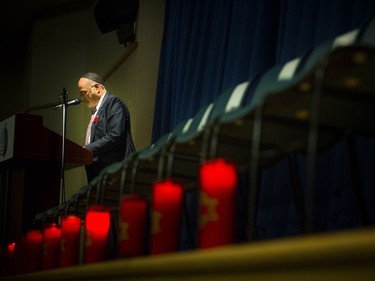 People gathered at the Soloway Jewish Community Centre Sunday October 28, 2018, for a vigil after the shooting in Pittsburgh this weekend that left 11 dead at a synagogue. Rabbi Reuven Bulka speaks to the crowd as he stands amongst the 11 chairs and candles for those who have passed.   Ashley Fraser/Postmedia