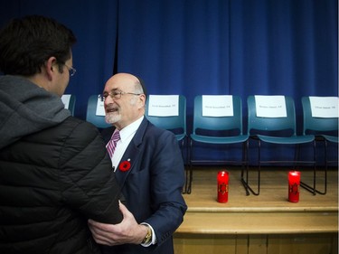 People gathered at the Soloway Jewish Community Centre Sunday October 28, 2018, for a vigil after the shooting in Pittsburgh this weekend that left 11 dead at a synagogue. Rabbi Reuven Bulka greets MP Pierre Poilievre Sunday evening. 

Ashley Fraser/Postmedia