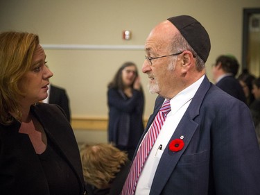 People gathered at the Soloway Jewish Community Centre Sunday October 28, 2018, for a vigil after the shooting in Pittsburgh this weekend that left 11 dead at a synagogue. MPP Lisa MacLeod speaks with Rabbi Reuven Bulka Sunday evening.   Ashley Fraser/Postmedia
