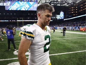 Packers kicker Mason Crosby walks off the field after the game in which he missed four field-goal attempts and a extra point against the Lions.