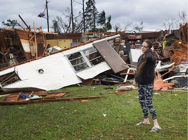 PANAMA CITY, FL - OCTOBER 10:  Haley Nelson stands in front of what is left of one of her fathers trailer homes after hurricane Michael passed through the area on October 10, 2018 in Panama City, Florida. The hurricane hit the Florida Panhandle as a category 4 storm.