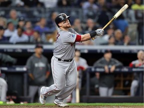 Christian Vazquez of the Red Sox hits a solo home run in the fourth inning against the Yankees on Tuesday night.