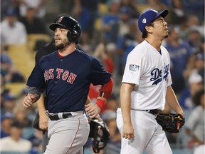 Pitcher Kenta Maeda of the Los Angeles Dodgers reacts after giving up an RBI single to Xander Bogaerts of the Boston Red Sox (not in photo) as Steve Pearce scores in the ninth inning at Dodger Stadium on Saturday, Oct. 27, 2018 in Los Angeles.