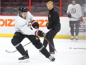 Assistant coach Rob Cookson watches as Mark Stone tips a shot on net during Senators practice at Canadian Tire Centre on Tuesday morning. Jean Levac/Postmedia