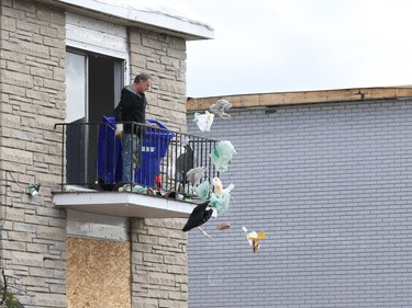 A man empties the contents of a low-rise apartment in the Mont-Bleu area of Gatineau, October 12, 2018.